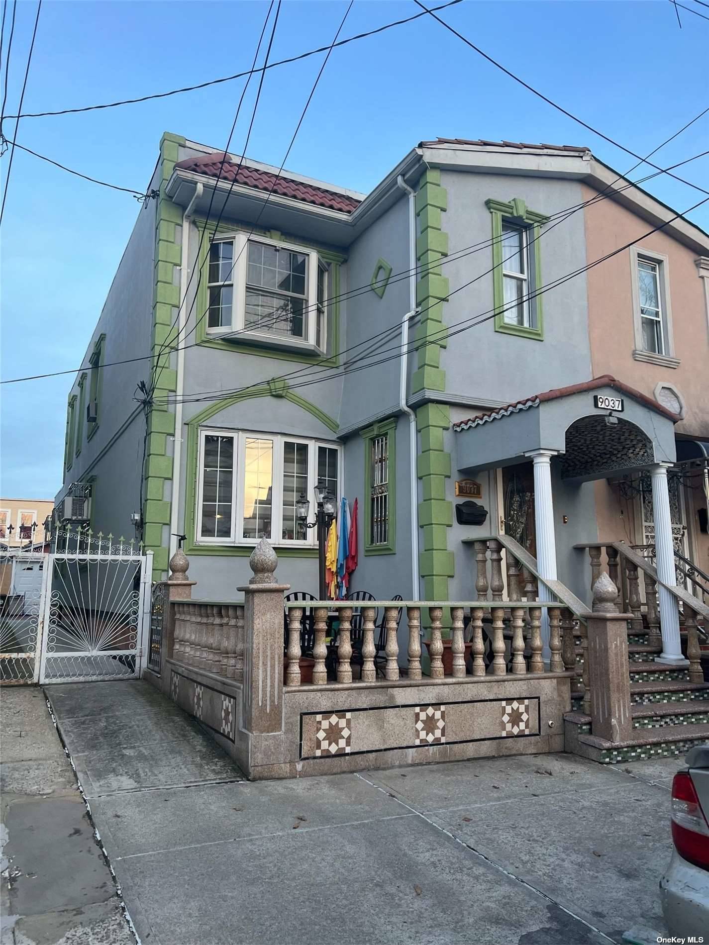 front view of a house with a small yard