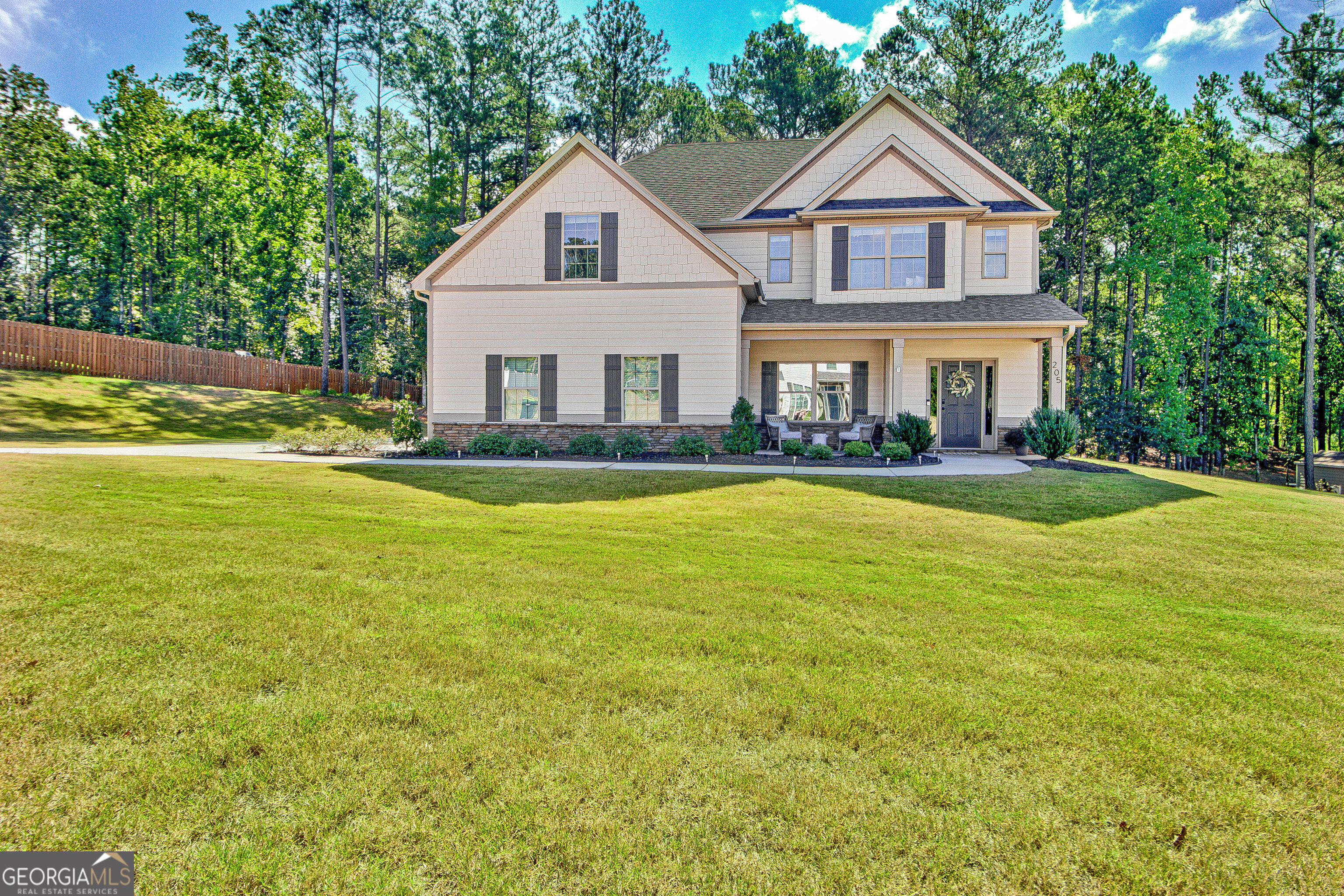 a front view of a house with a yard