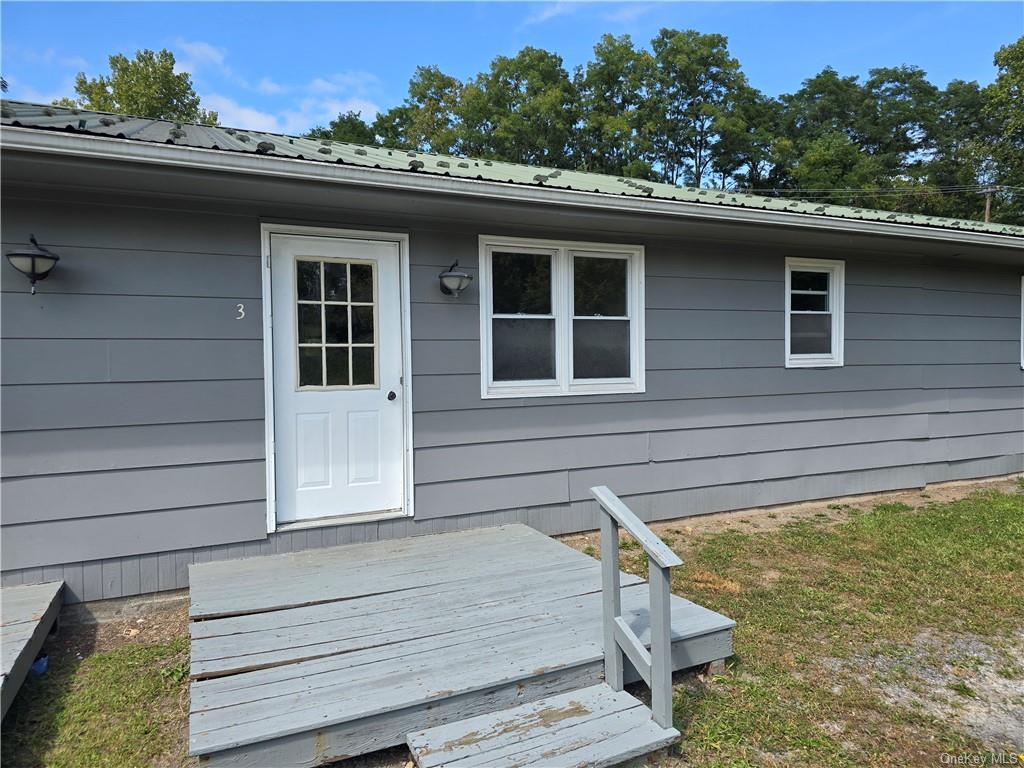 a side view of a house with a yard