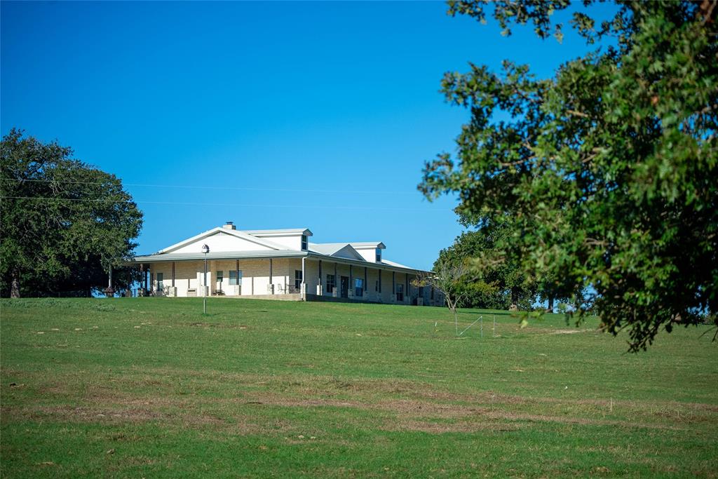 a view of a house with a big yard