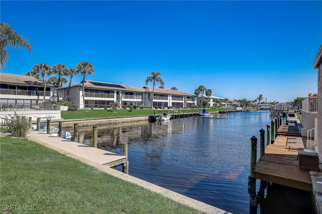 a view of a lake with a house in the background