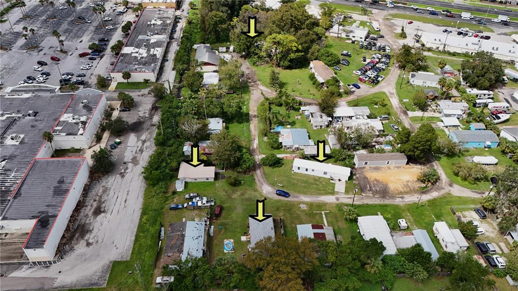 an aerial view of residential houses with outdoor space