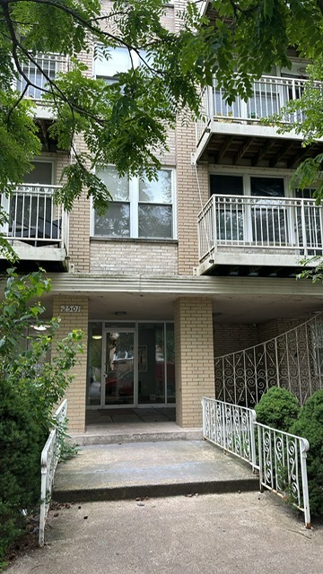 a front view of a house with a porch