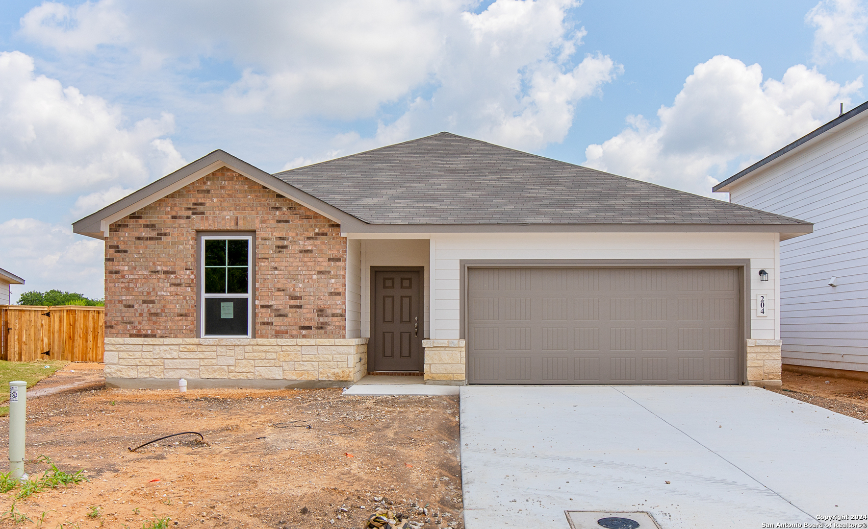 a front view of a house with a garage