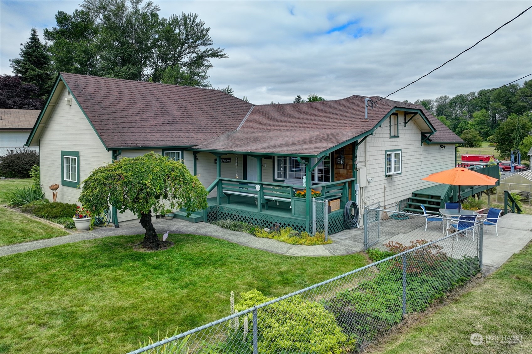 a view of a house with a yard porch and sitting area