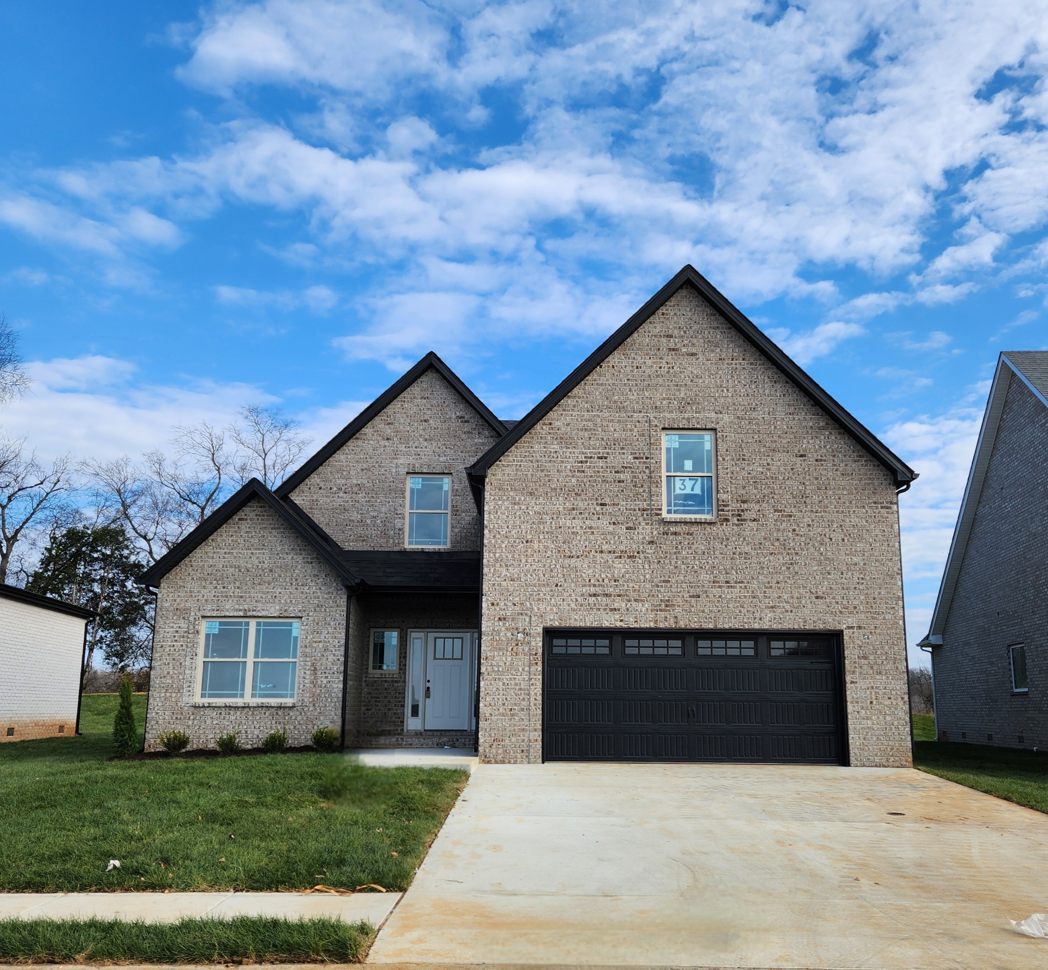 a front view of a house with yard