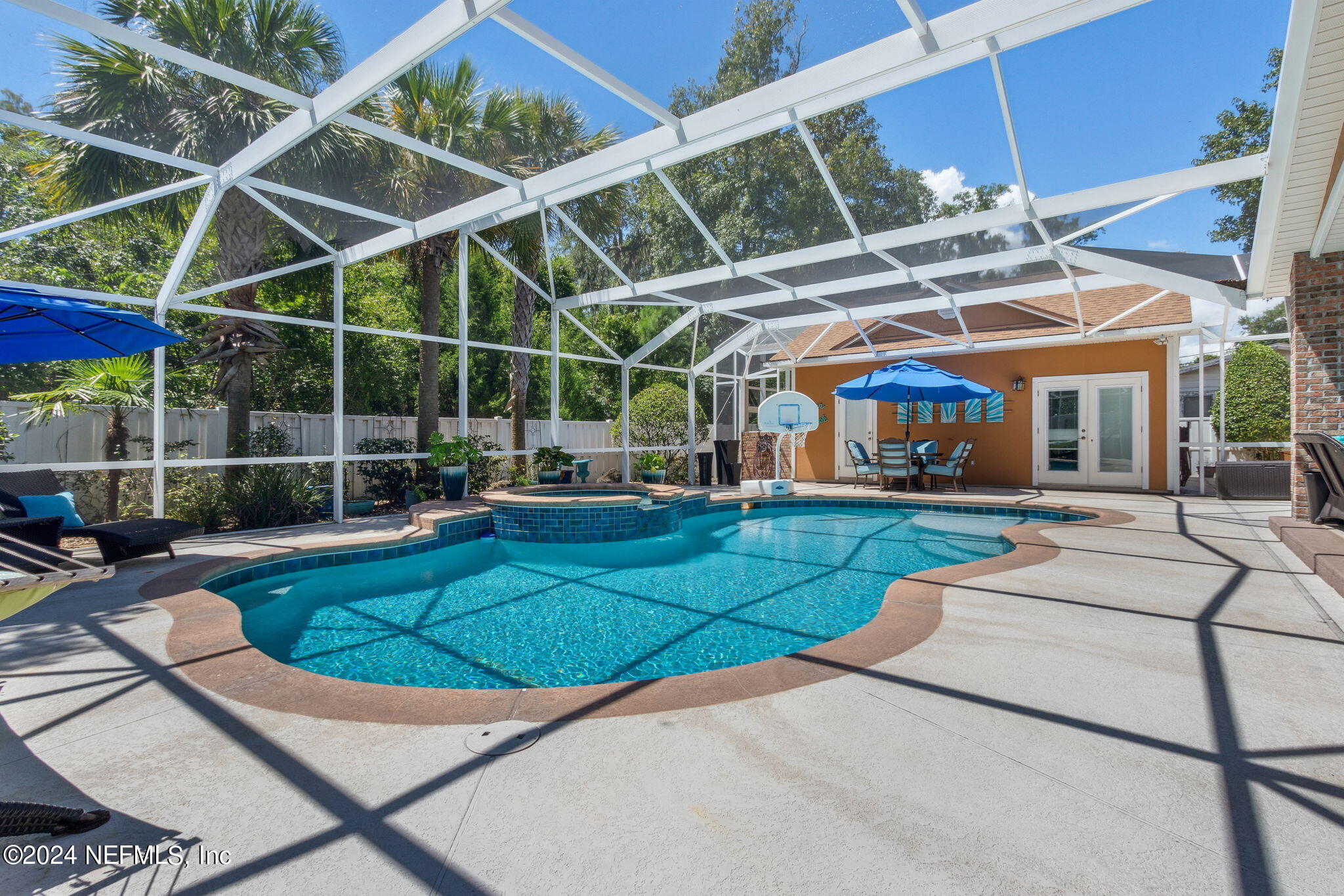 a view of a swimming pool with a patio