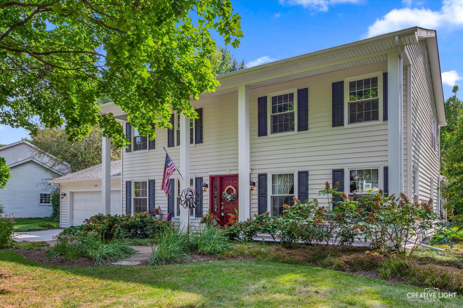 front view of a house with a yard