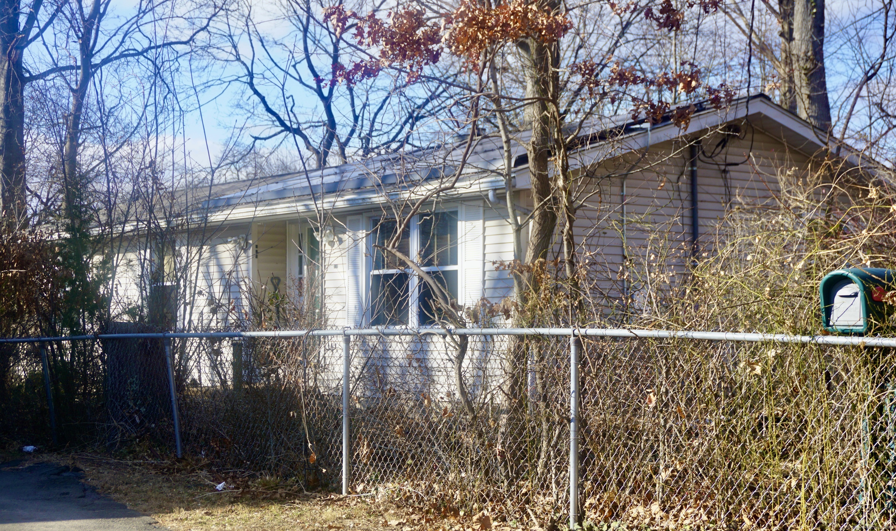 a view of a house with a tree