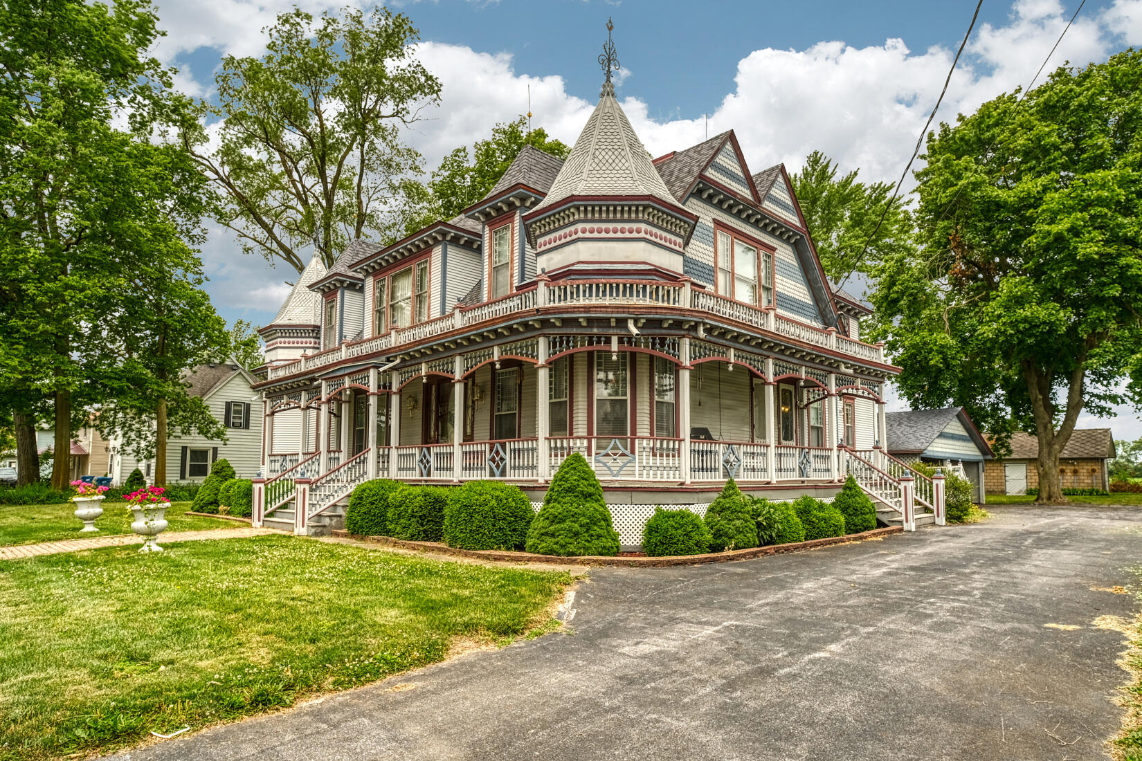 a front view of a house with a garden