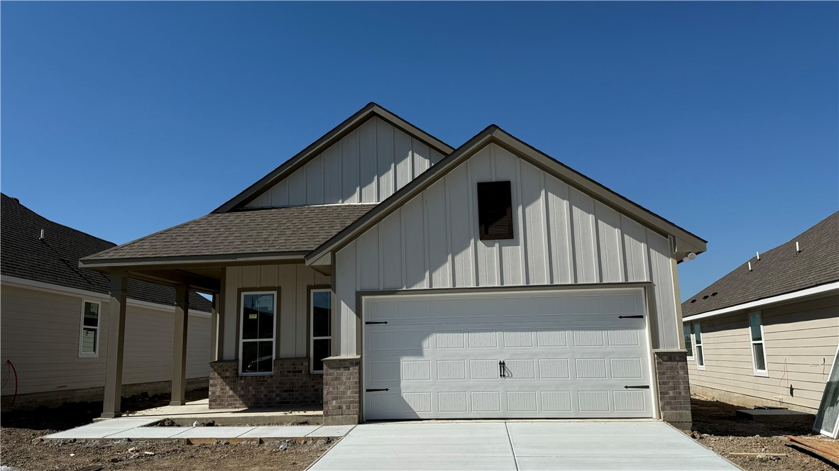 a front view of a house with a garage