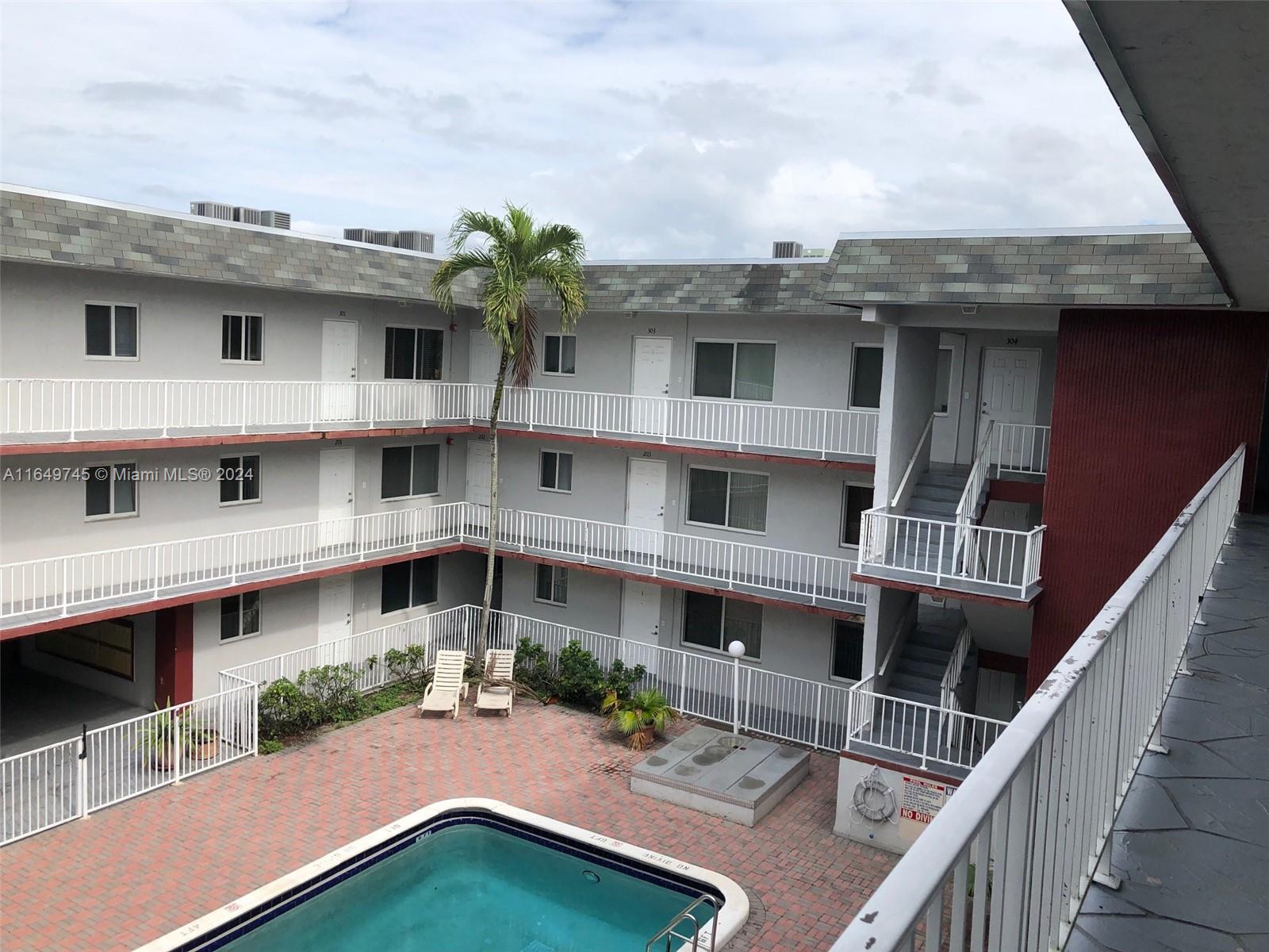 a view of a house with roof deck front of house