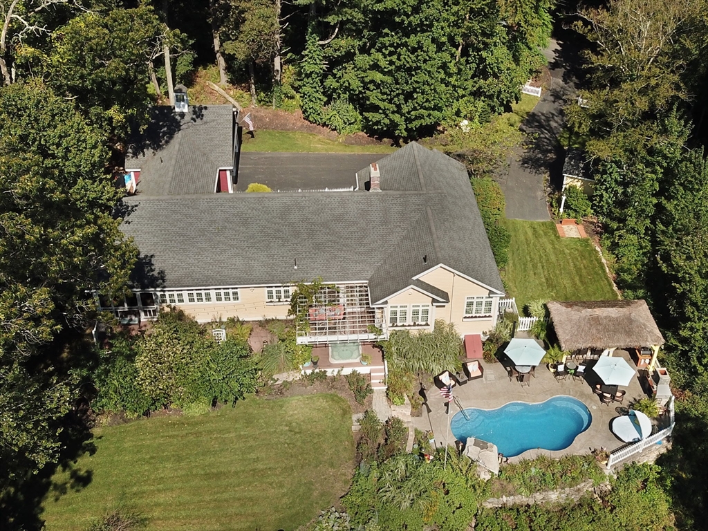 an aerial view of residential houses with outdoor space