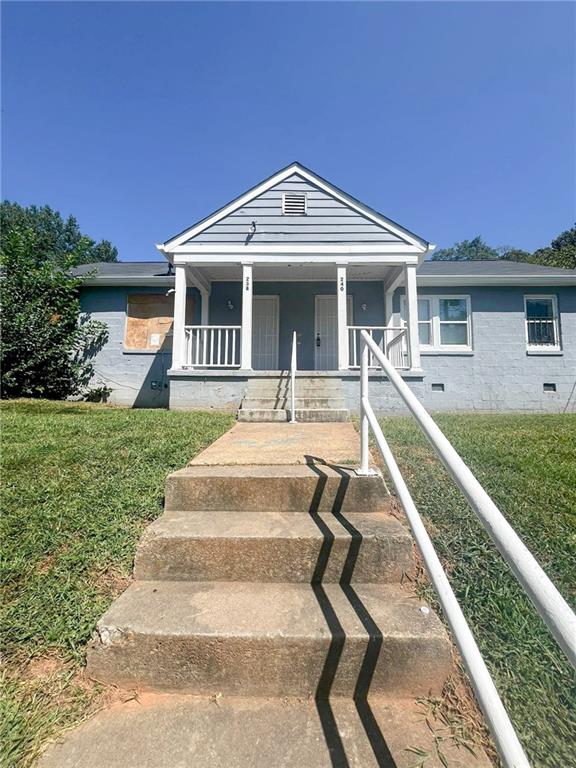 a front view of house with yard and green space