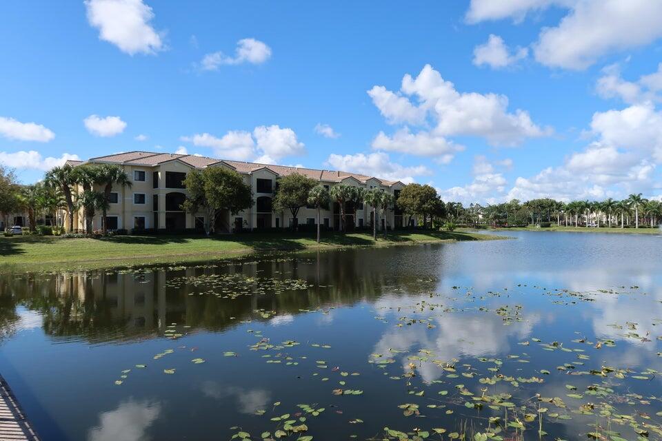 a view of a lake with a house in the background