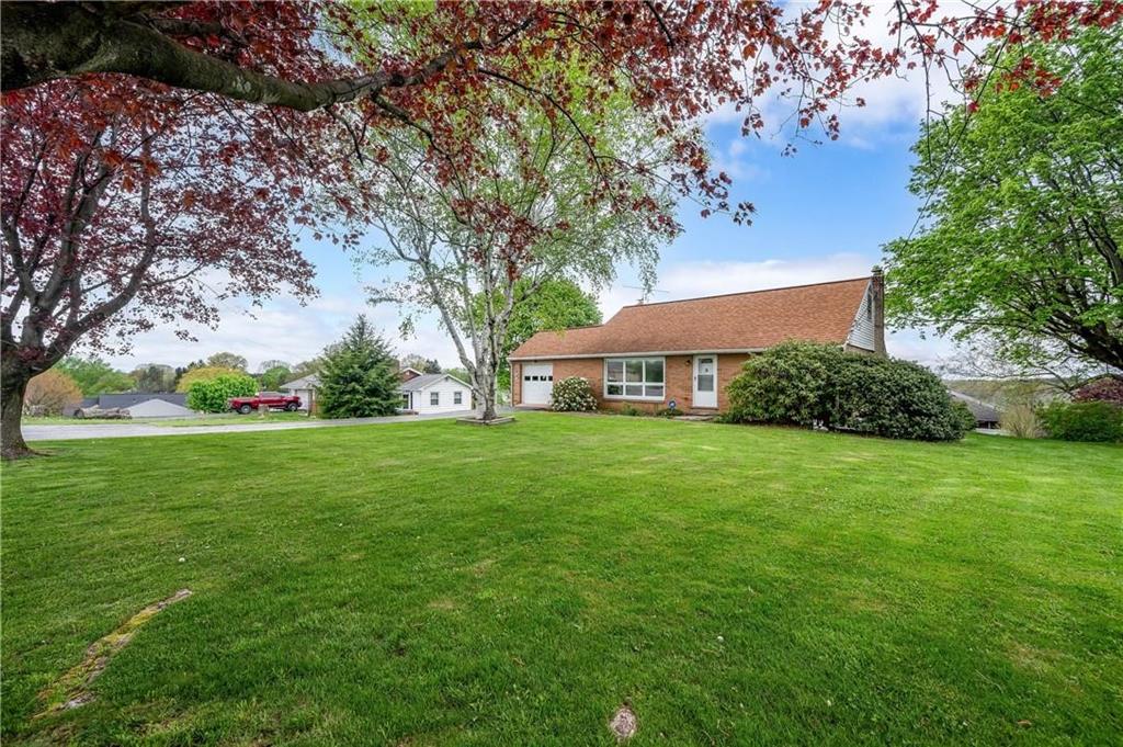 a view of a house with a big yard