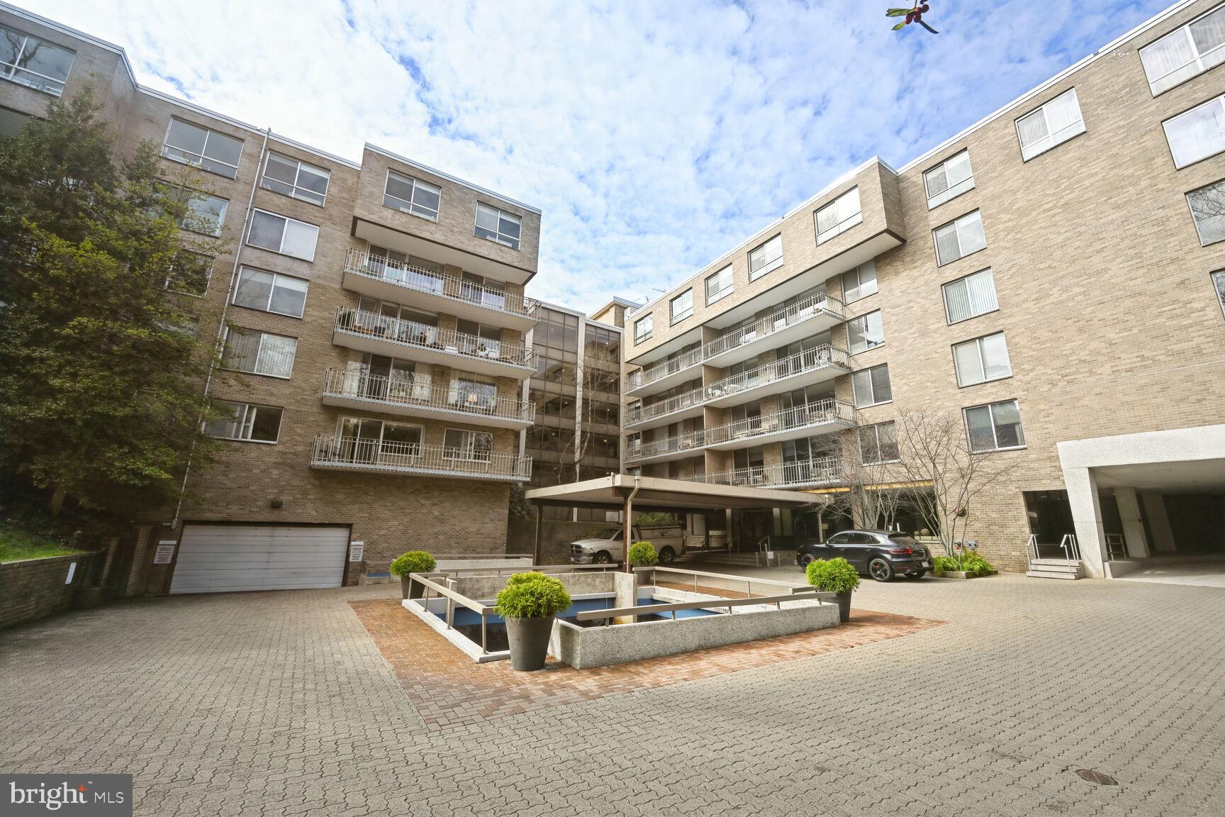 a view of a building with sitting area