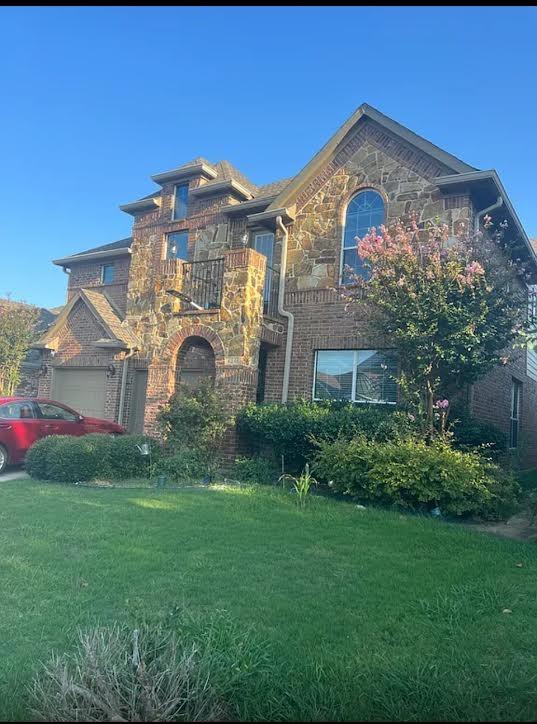 a front view of a house with garden