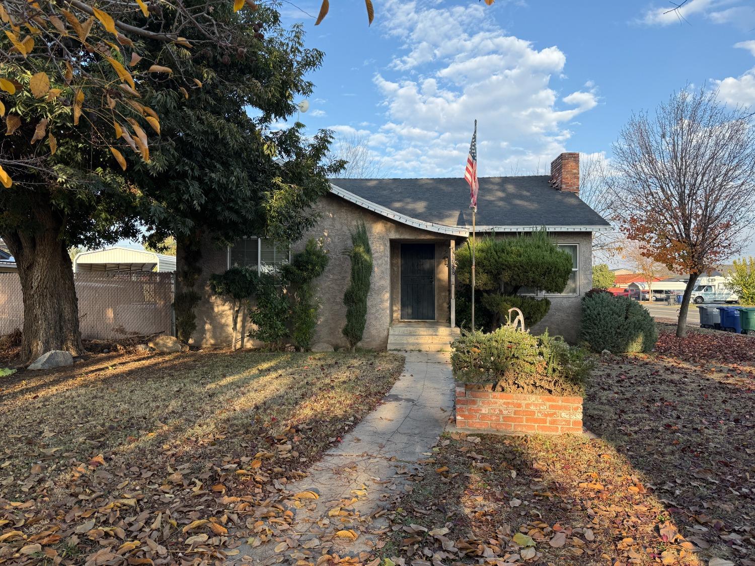 a view of a house with backyard porch and sitting area