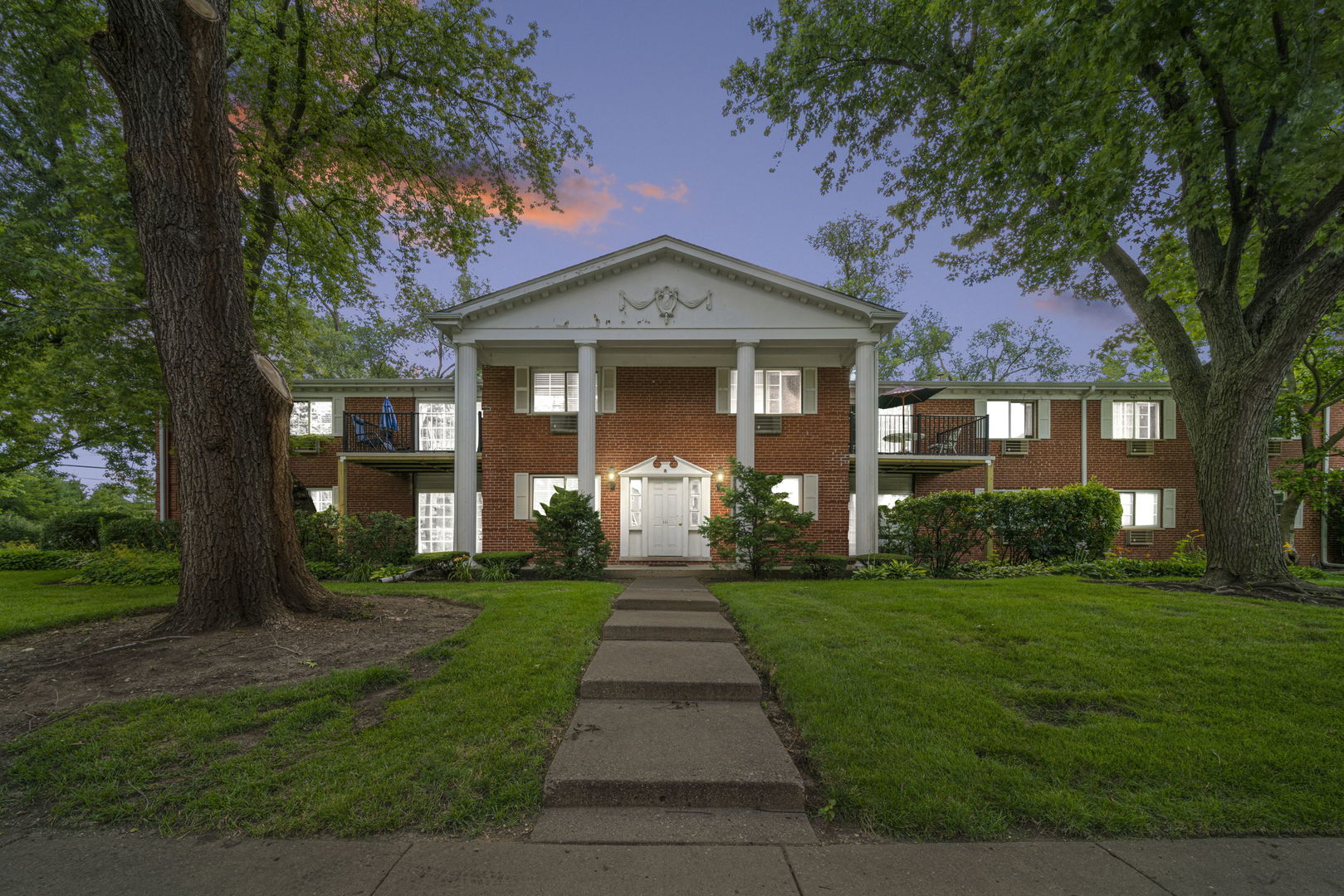 a front view of a house with yard