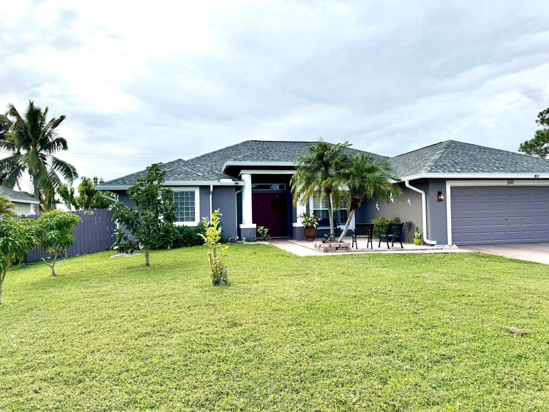 front view of a house with a yard