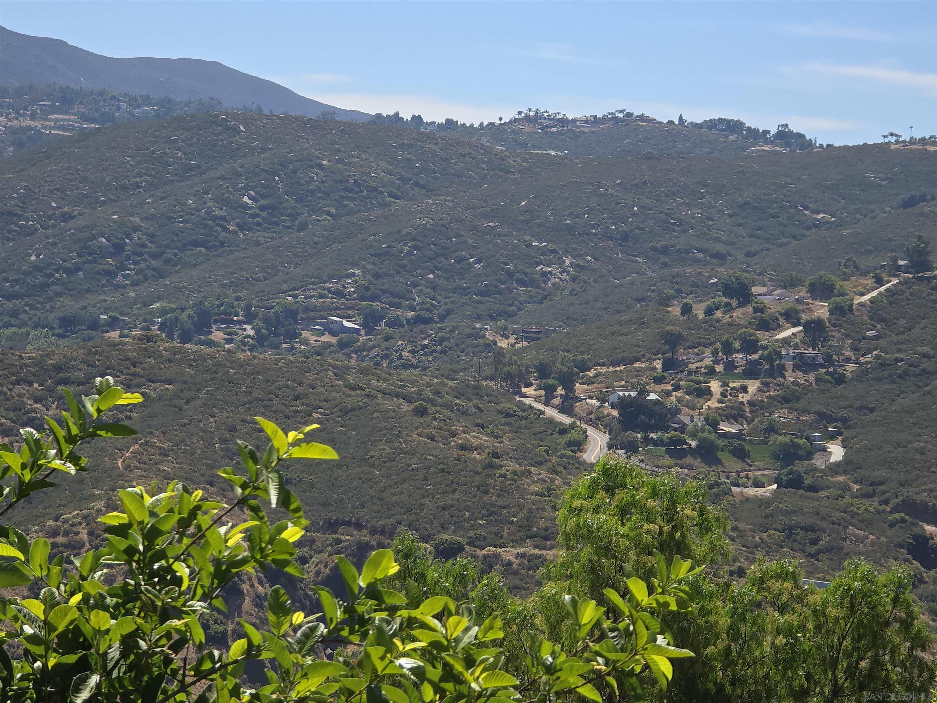 a view of a mountain with a swimming pool