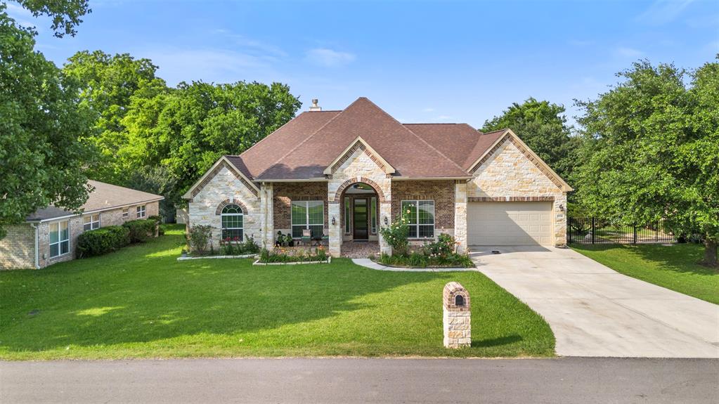 a front view of a house with garden