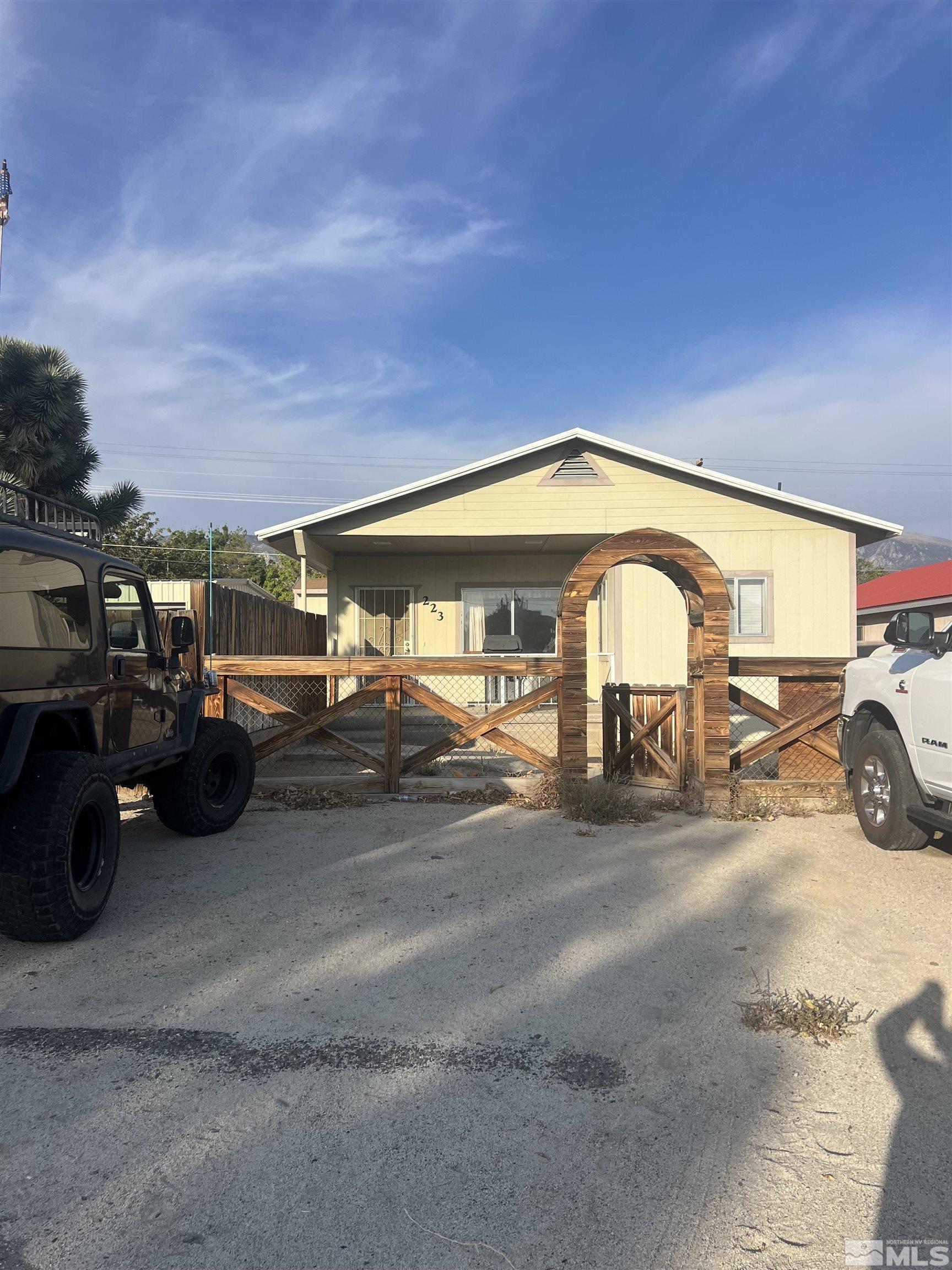 a view of a cars park in front of house