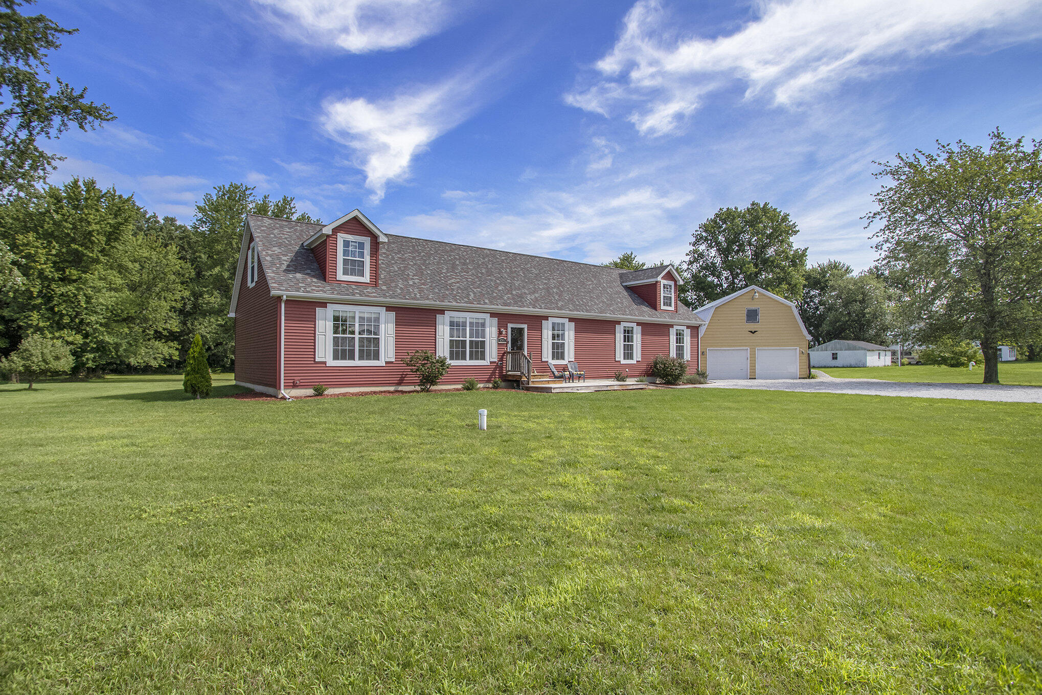 a view of a house with a backyard