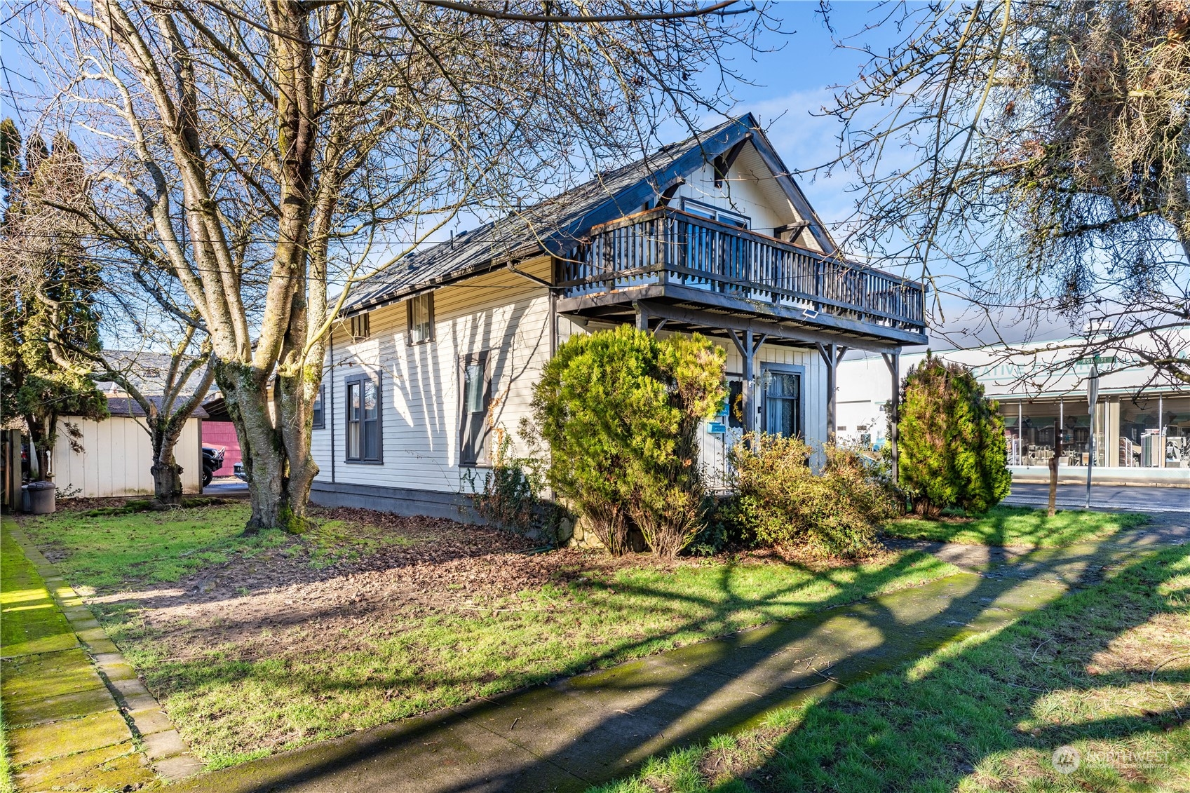 a front view of house with a garden