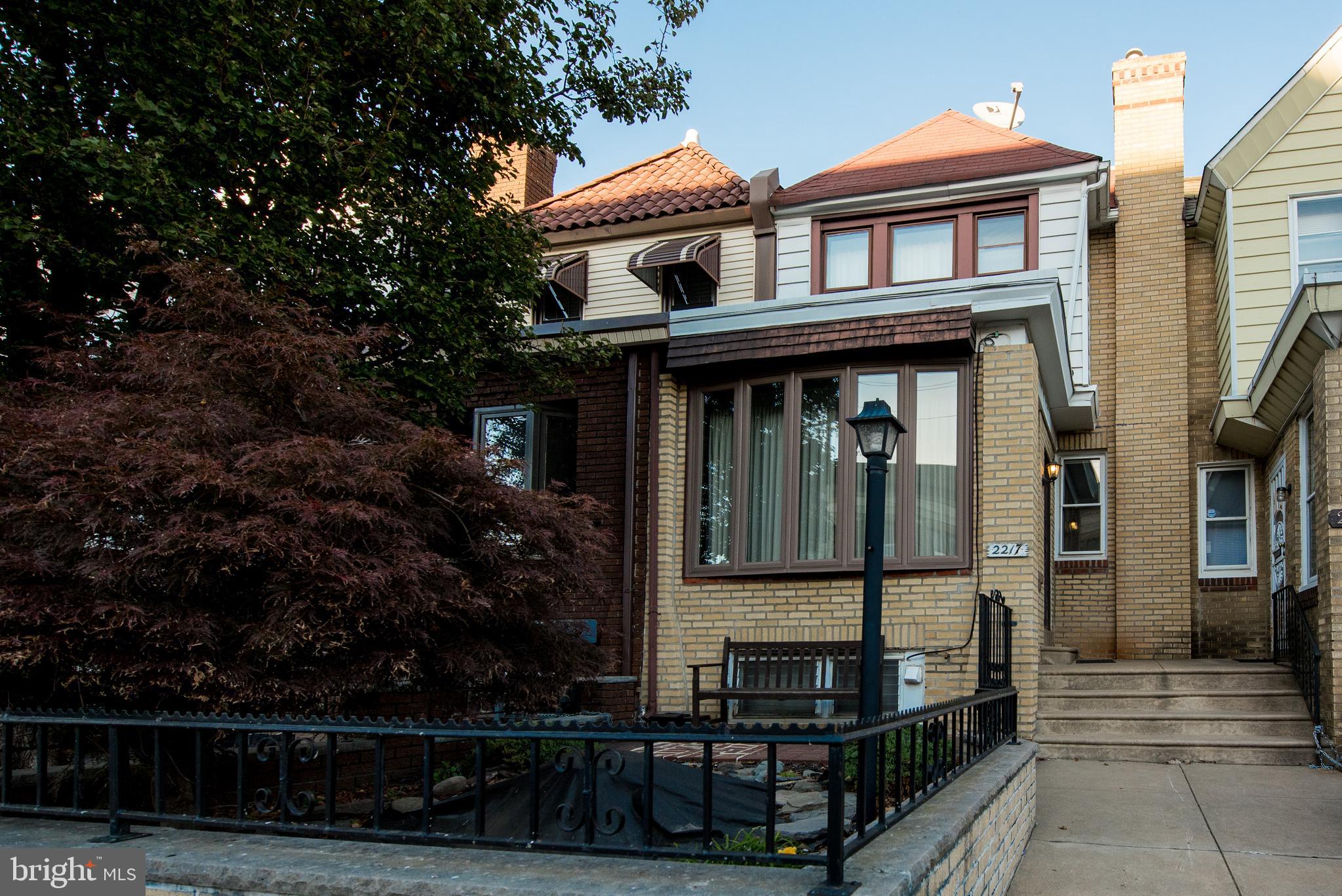 front view of a house with a small yard