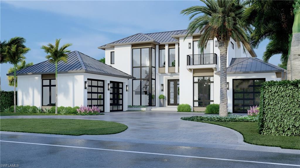 a front view of a house with a garden and plants