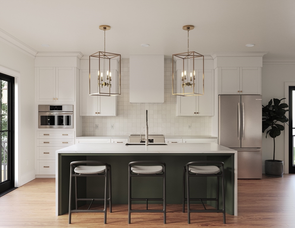 a kitchen with stainless steel appliances a sink stove and refrigerator