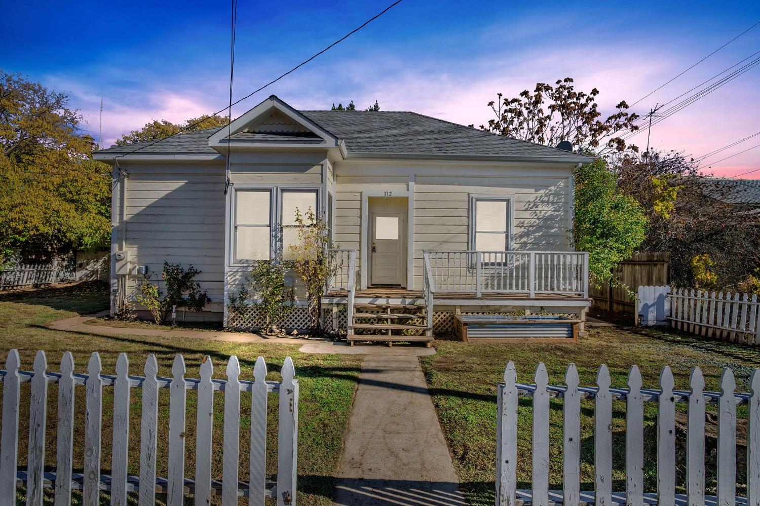 a front view of a house with a porch