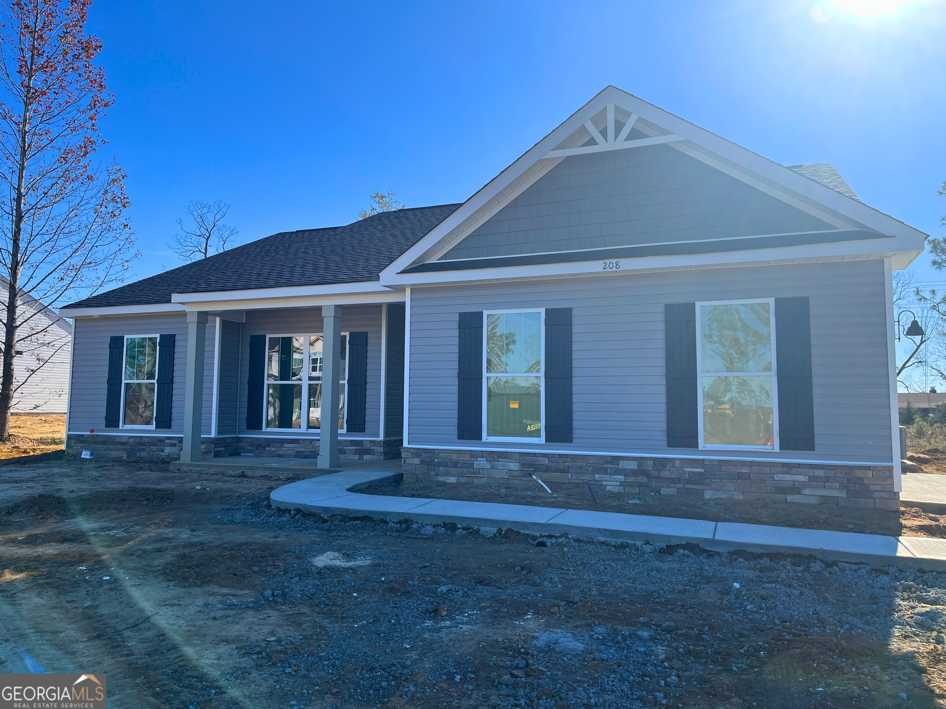 front view of a house with a yard