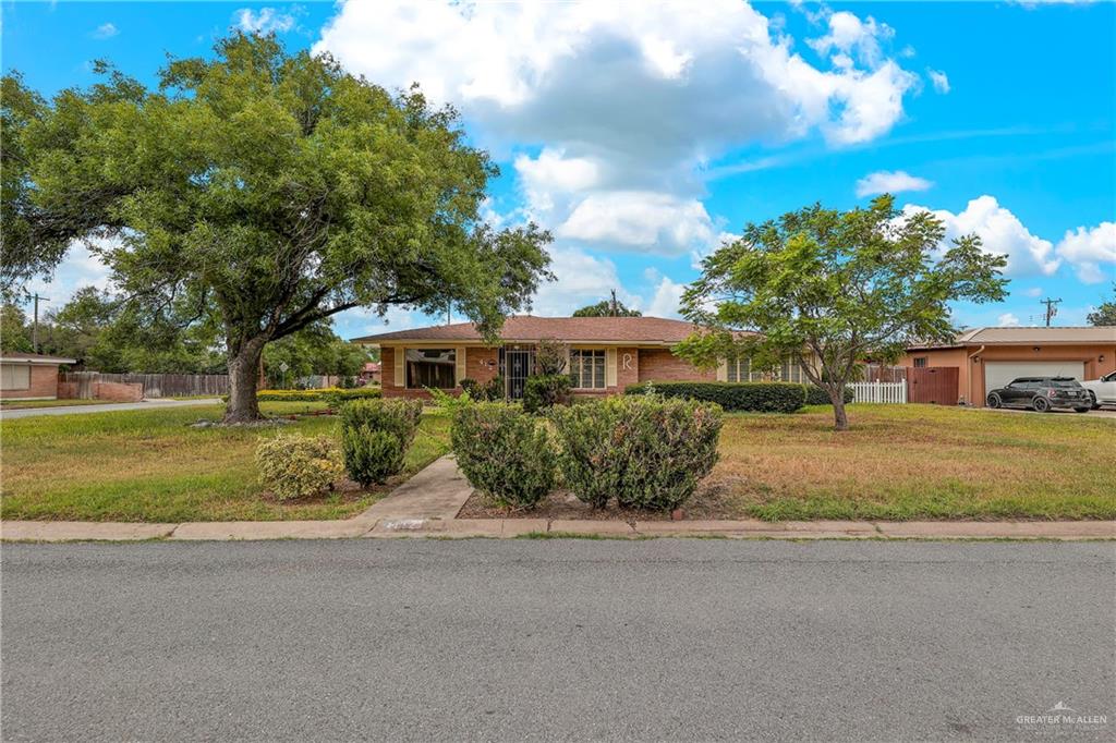 Home with a garage and a front yard