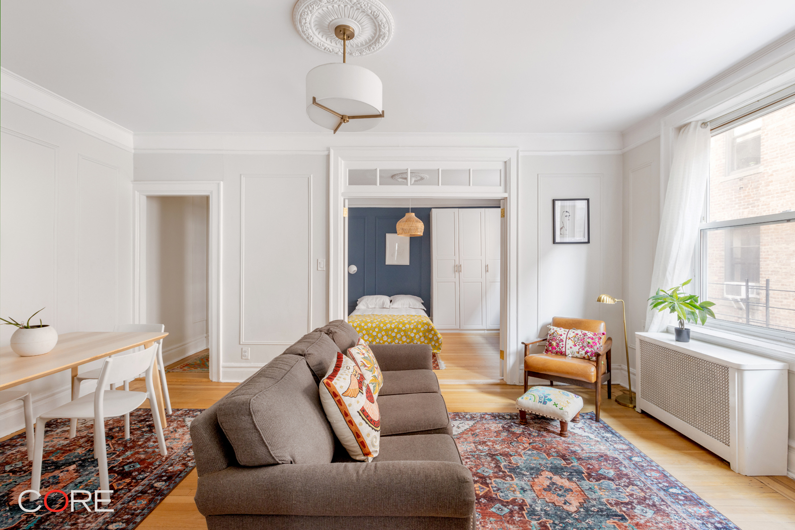 a living room with furniture and a window