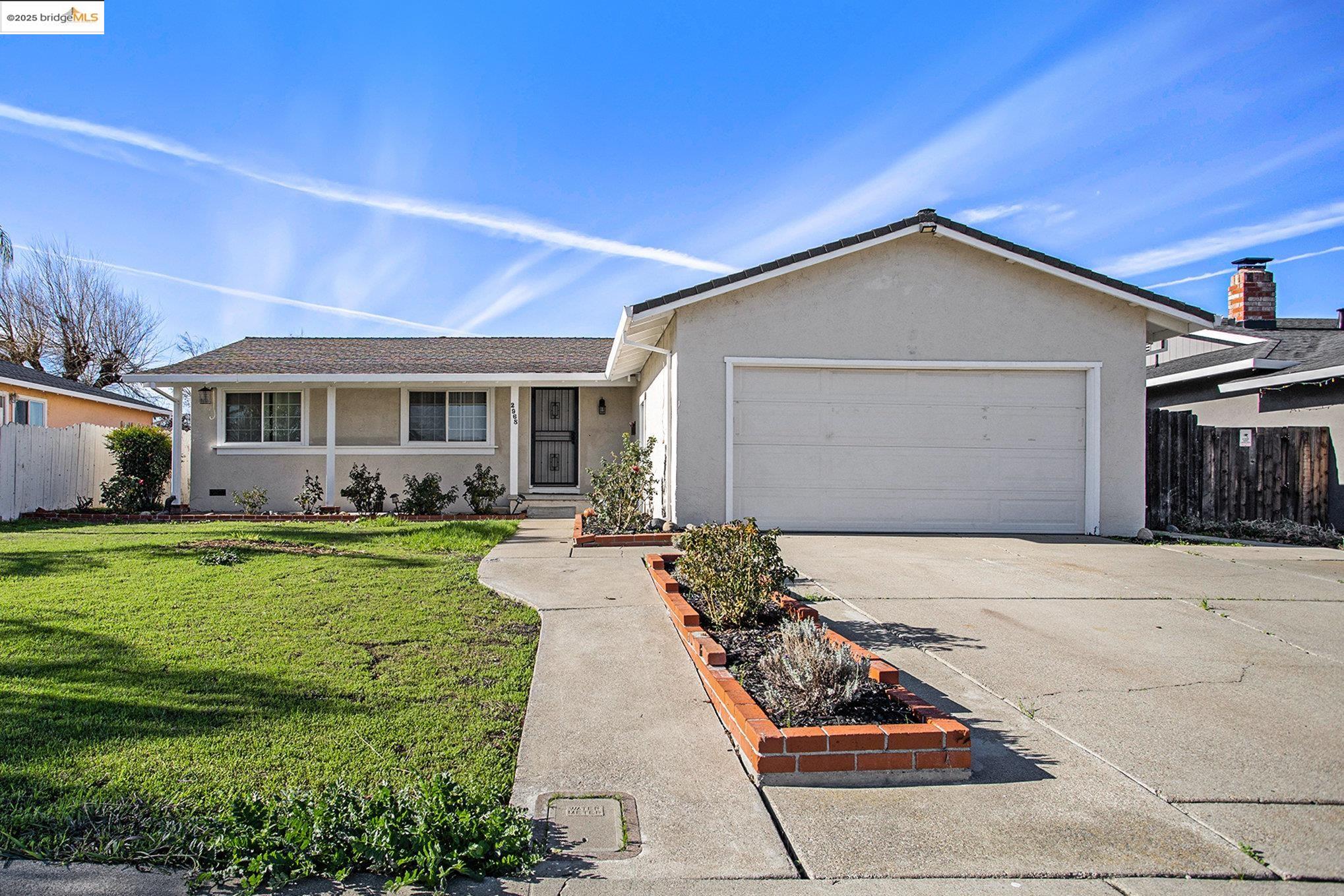 a front view of a house with garden