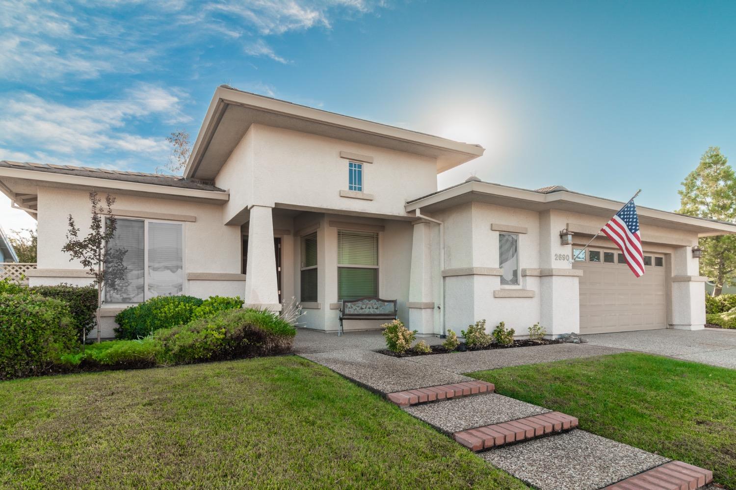 front view of a house with a yard