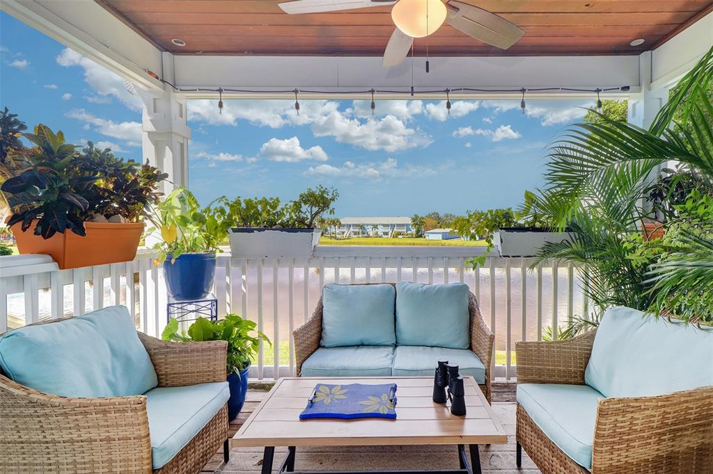 a outdoor living space with furniture and a potted plant