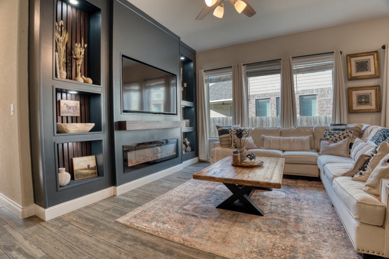 a living room with furniture and a fireplace