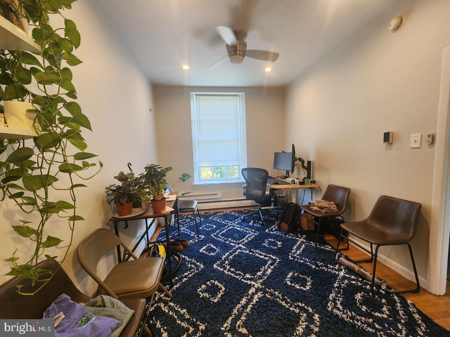 a living room with furniture and a rug