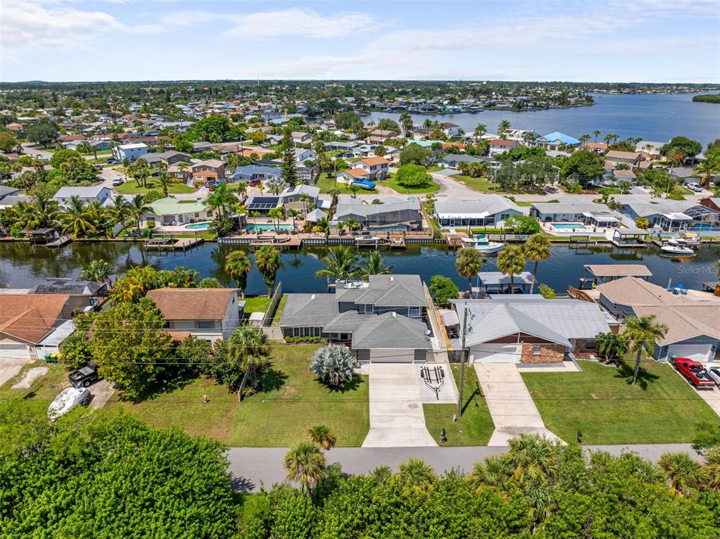 an aerial view of a house with a lake view