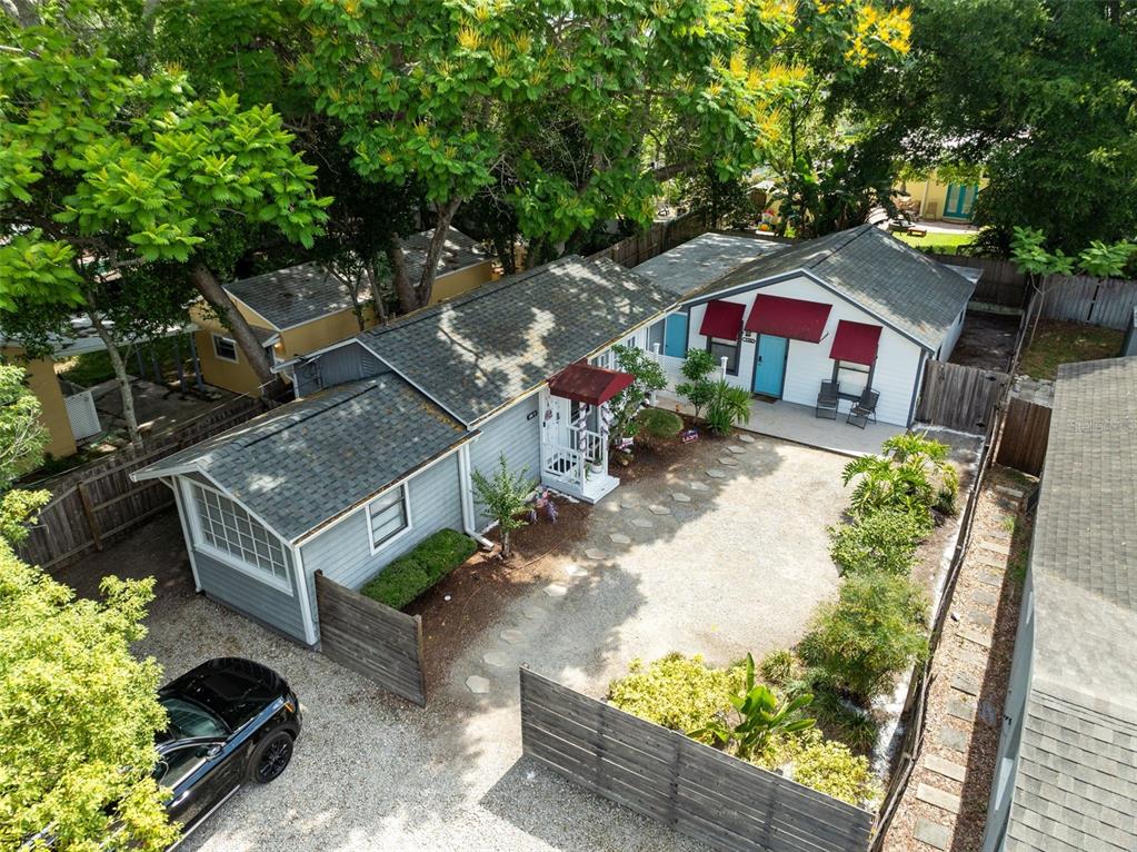 an aerial view of a house with a yard