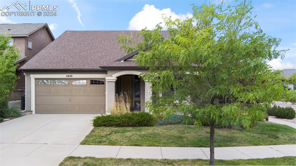 a front view of a house with a yard