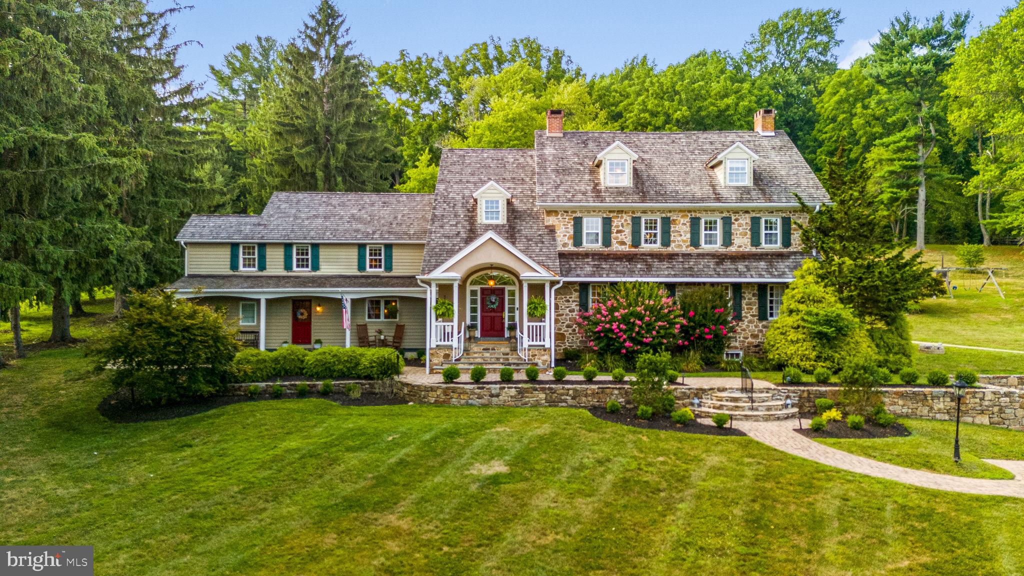 a front view of house with yard and green space