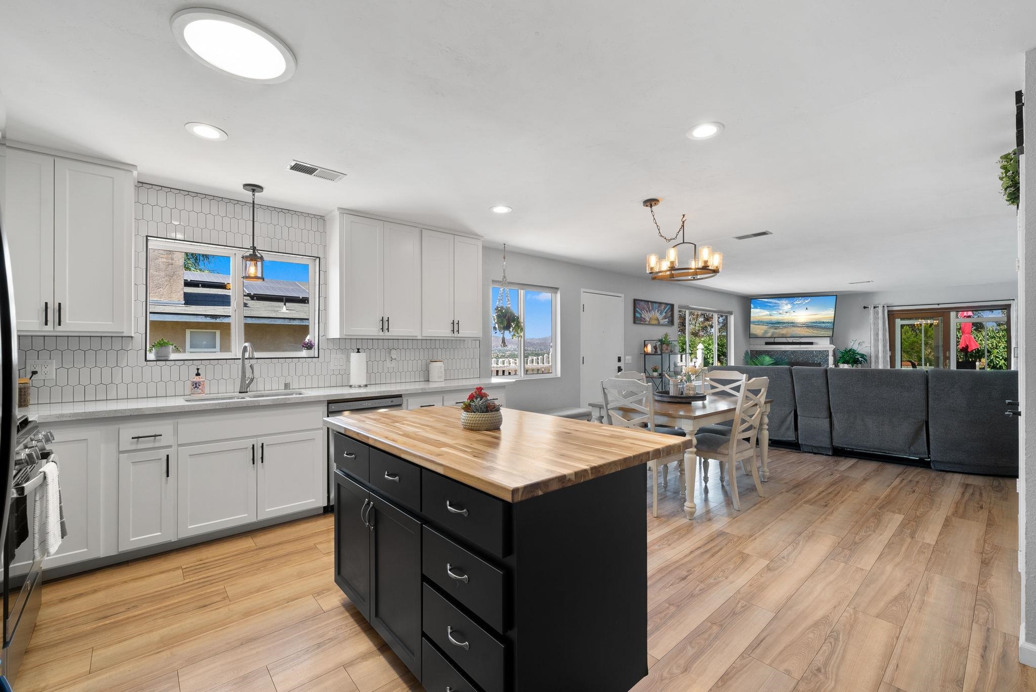 a kitchen with a cabinets counter top space a sink stainless steel appliances and cabinets