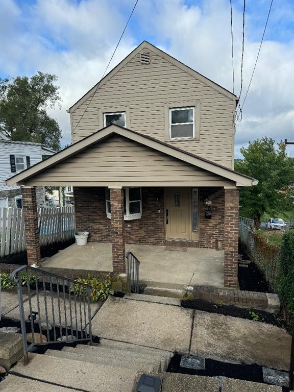 a front view of a house with garage