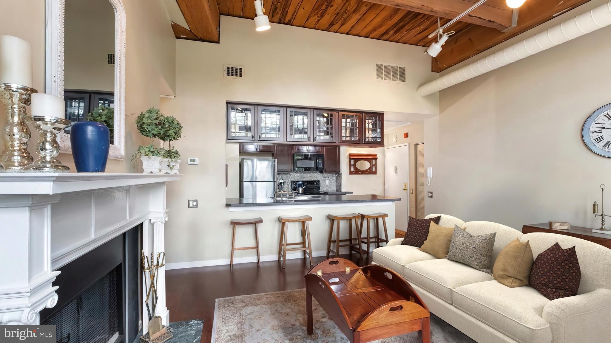 a living room with furniture and a fireplace