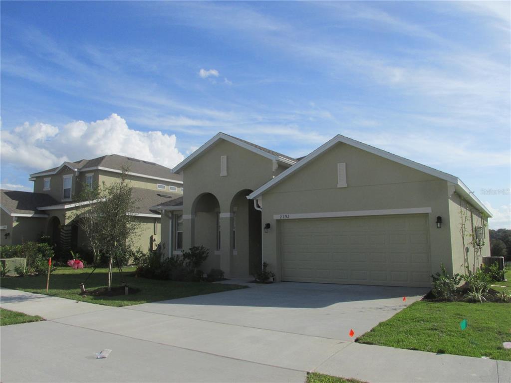 front view of a house with a yard